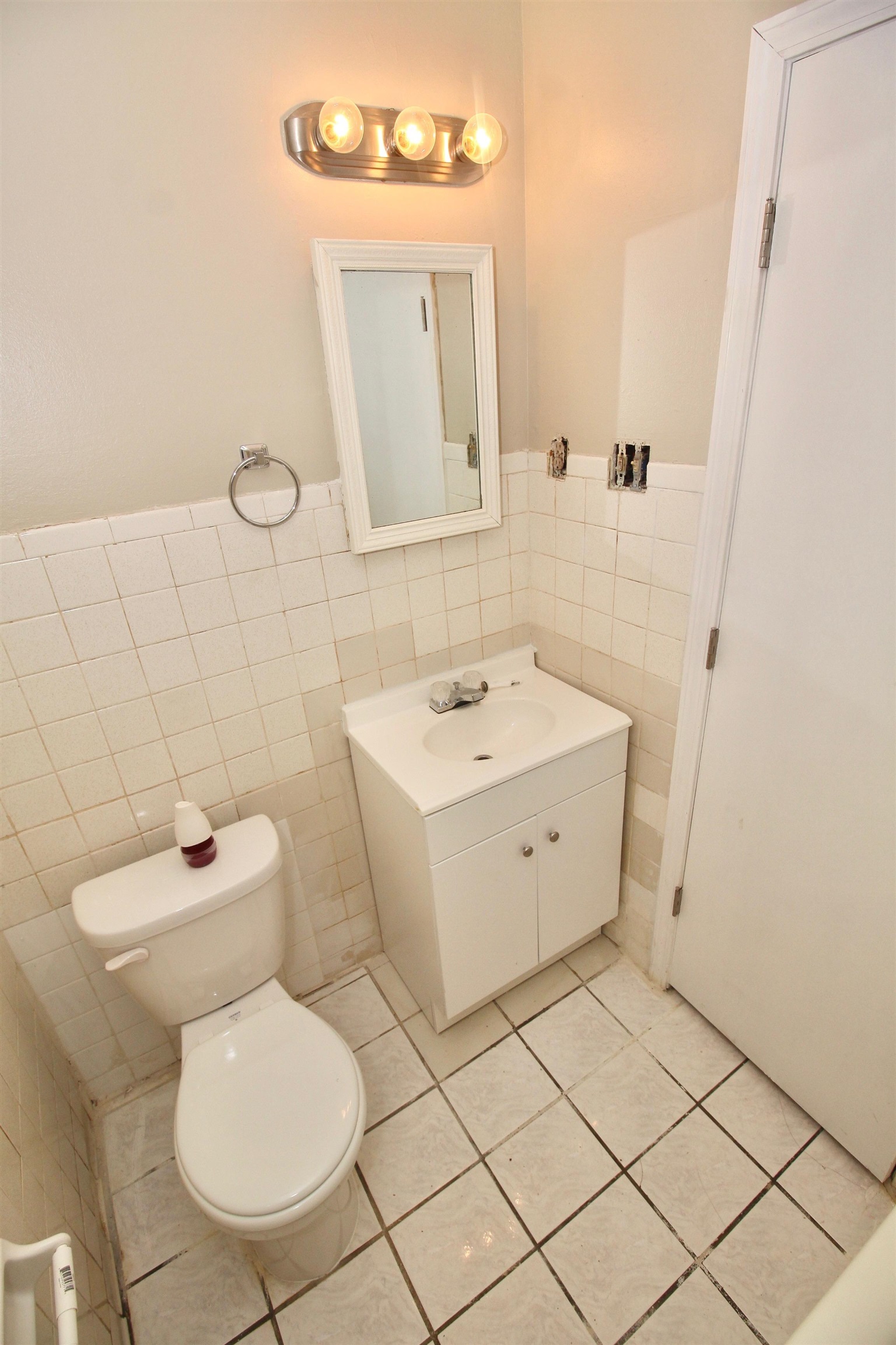 4780 Hillbrook Road Memphis, TN 38109 - Photo 9 of 14 a bathroom with a toilet sink and mirror