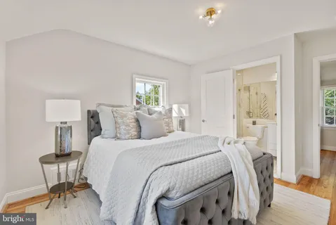 a bedroom with a bed and a table