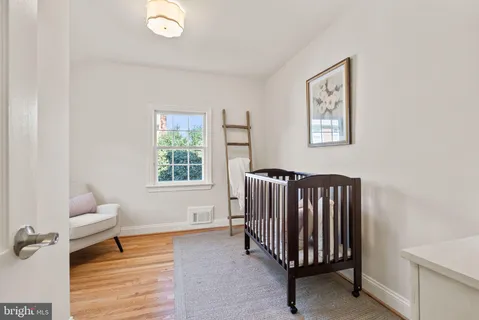 a living room with furniture and a chair