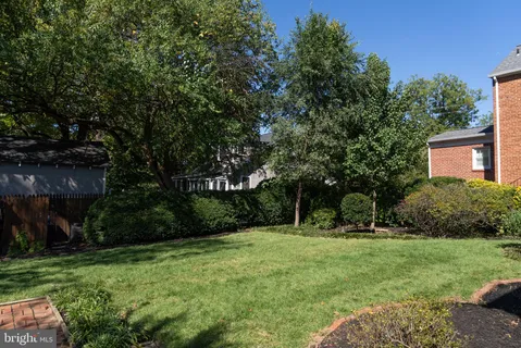 a view of a wooden deck and garden