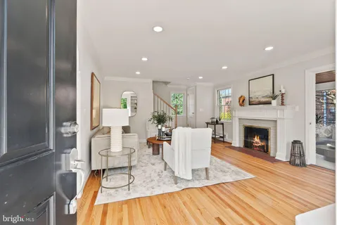 a view of a kitchen cabinets a refrigerator and wooden floor