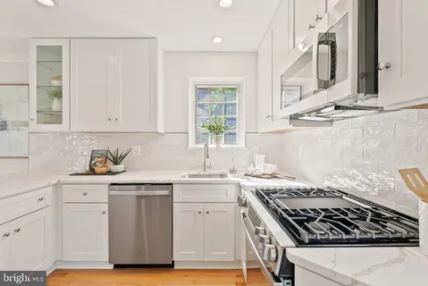 a view of a livingroom with furniture and a window