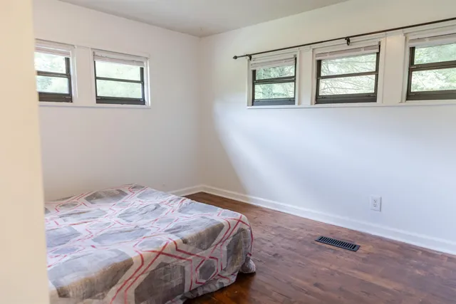 a bathroom with a glass door shower