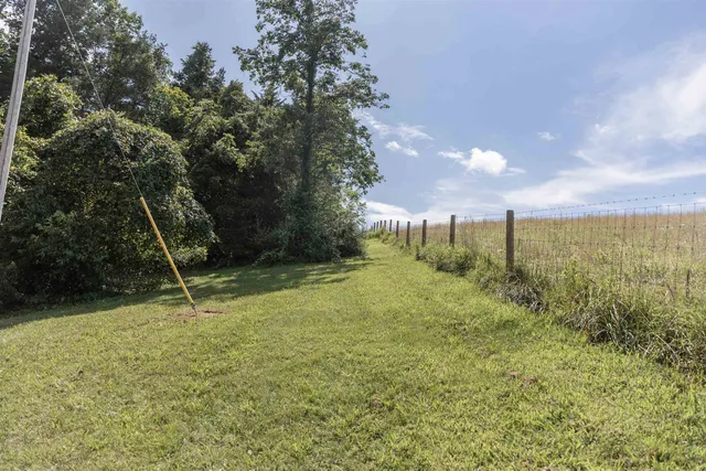 a house view with a sitting space and garden space