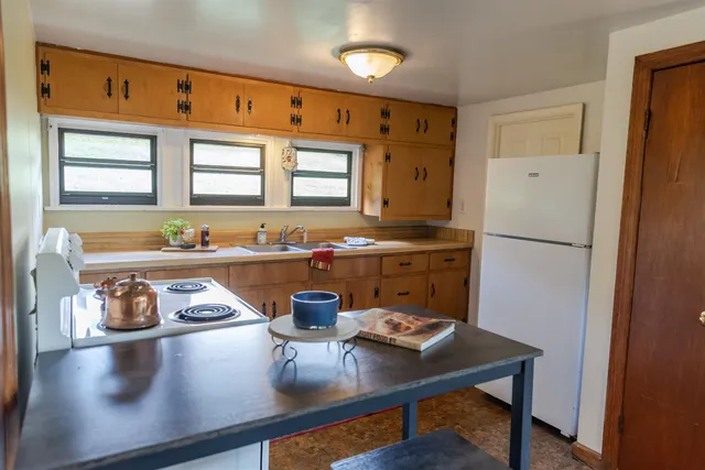 a bathroom with a sink a vanity and a mirror