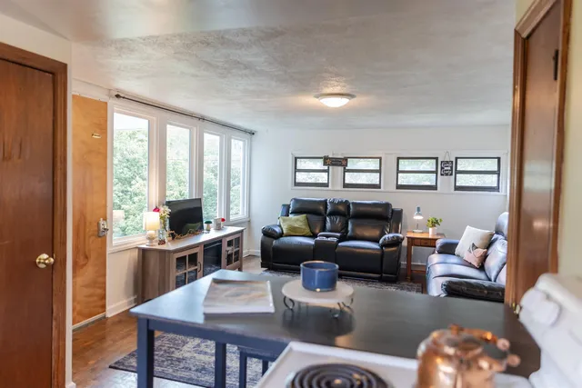 a living room with furniture and windows