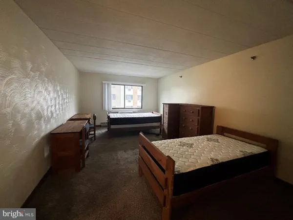 a living room with furniture and flat screen tv
