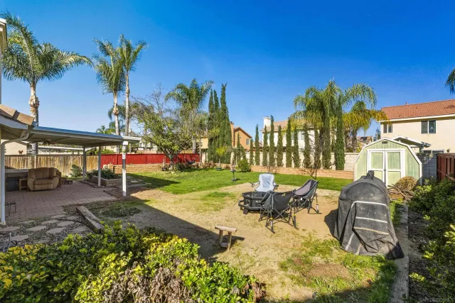a view of a swimming pool with a patio