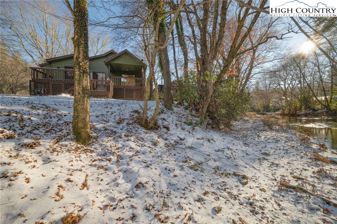 208 Meadow Loop Newland, NC 28657 - Photo 40 of 46 a front view of a house with a yard