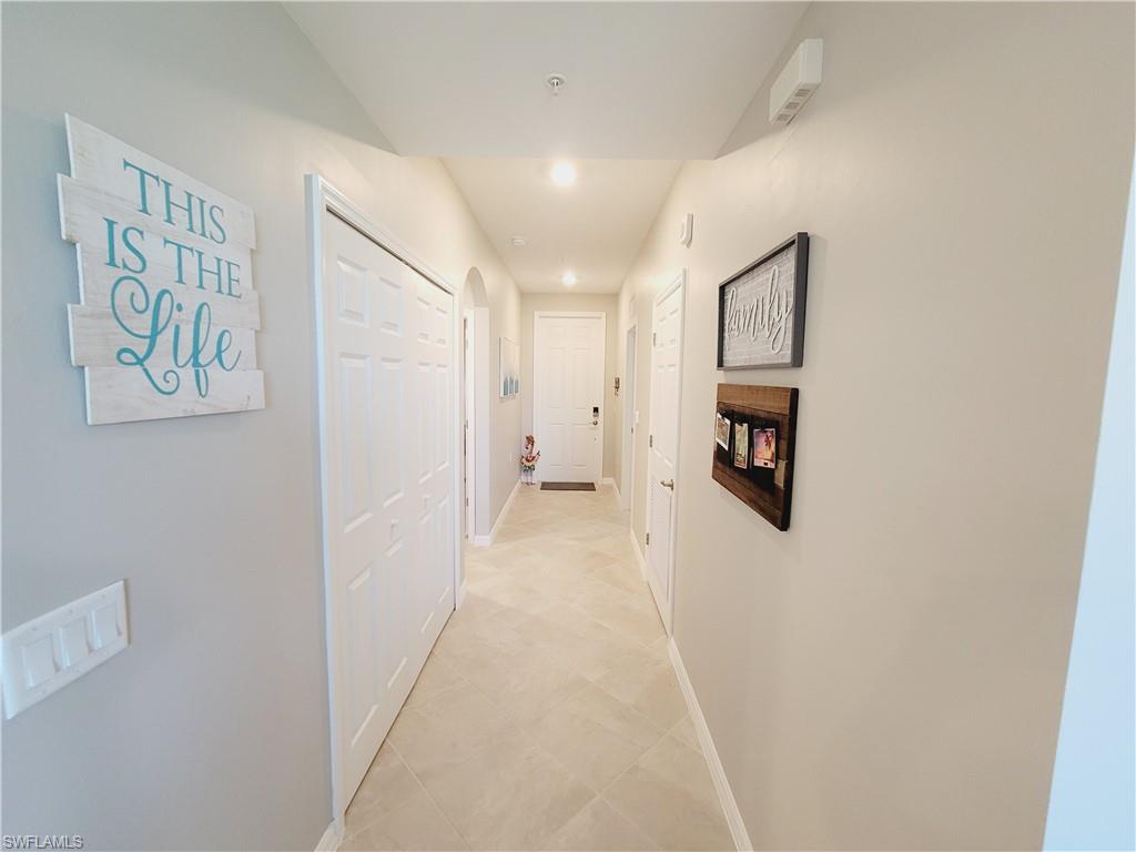 43981 Boardwalk Loop, Unit 2232 Punta Gorda, FL 33982 - Photo 12 of 34 Corridor with light tile patterned floors