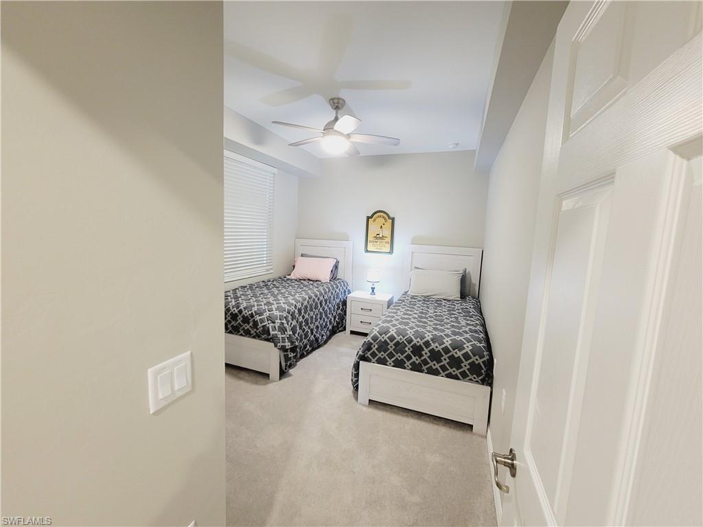 43981 Boardwalk Loop, Unit 2232 Punta Gorda, FL 33982 - Photo 13 of 34 Carpeted bedroom with ceiling fan