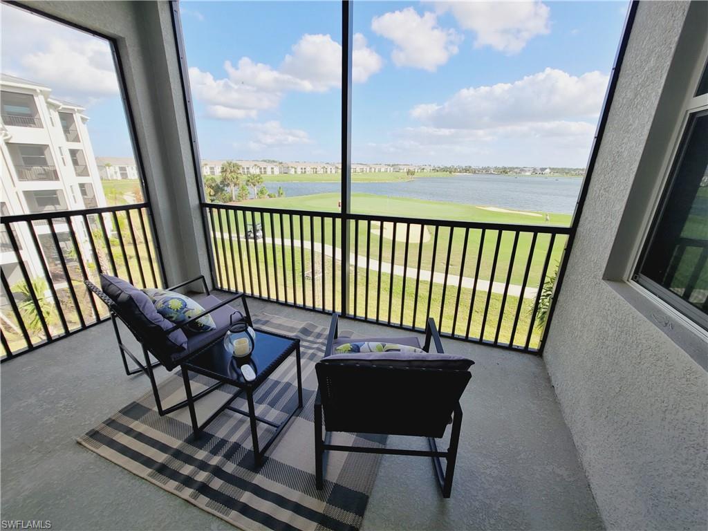 43981 Boardwalk Loop, Unit 2232 Punta Gorda, FL 33982 - Photo 5 of 34 Sunroom featuring a water view