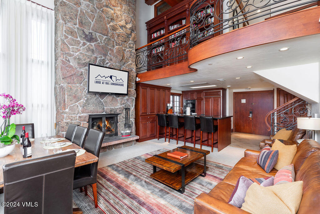 174 Gore Creek Drive, Unit 368 Vail, CO 81657 - Photo 1 of 26 a living room with furniture and a fireplace