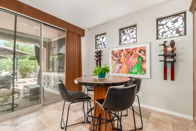 a view of a livingroom with furniture and a window
