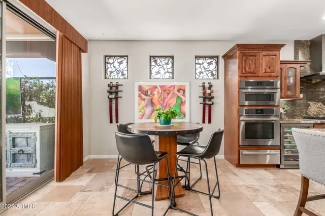 a view of a dining room with furniture window and outside view