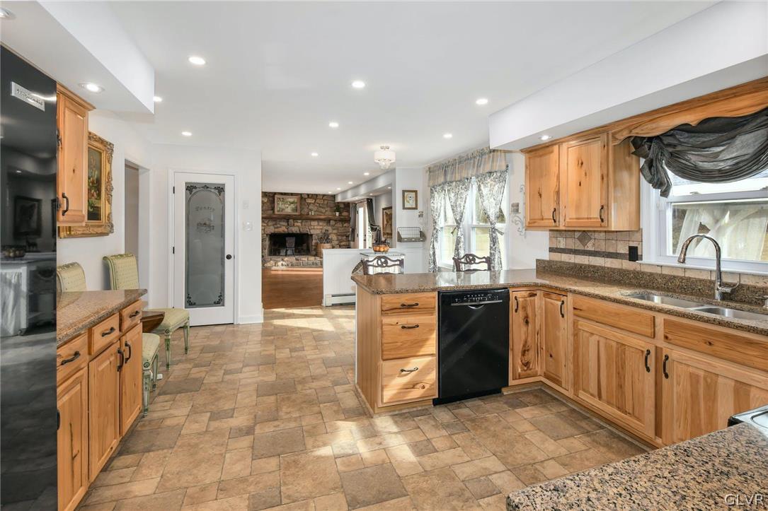 4384 Lehnenberg Road Riegelsville, PA 18077 - Photo 13 of 36 a large kitchen with stainless steel appliances granite countertop a large stove a sink and a refrigerator