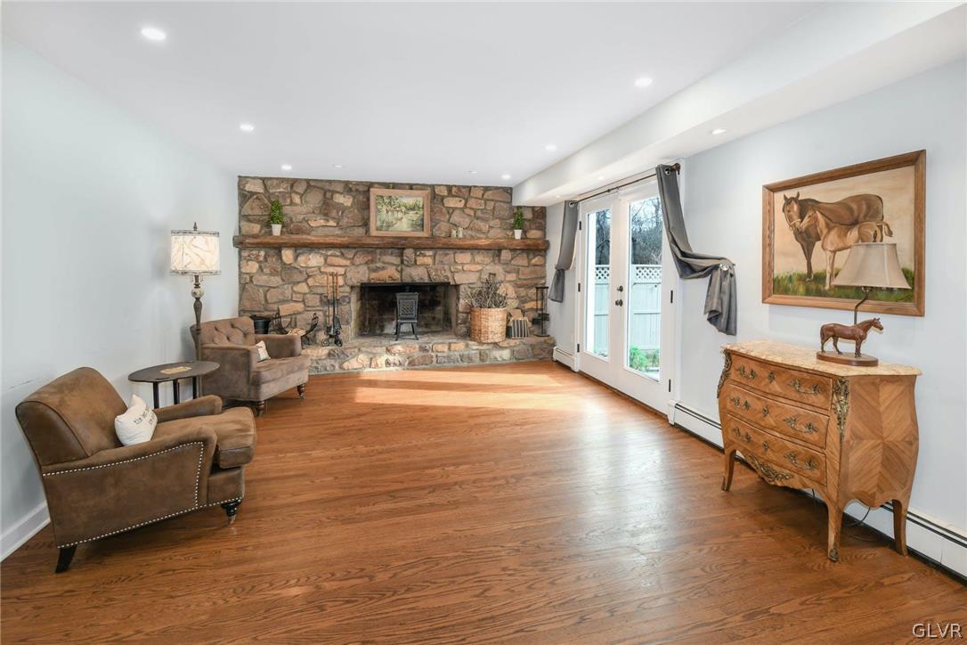4384 Lehnenberg Road Riegelsville, PA 18077 - Photo 14 of 36 a living room with furniture and a fireplace