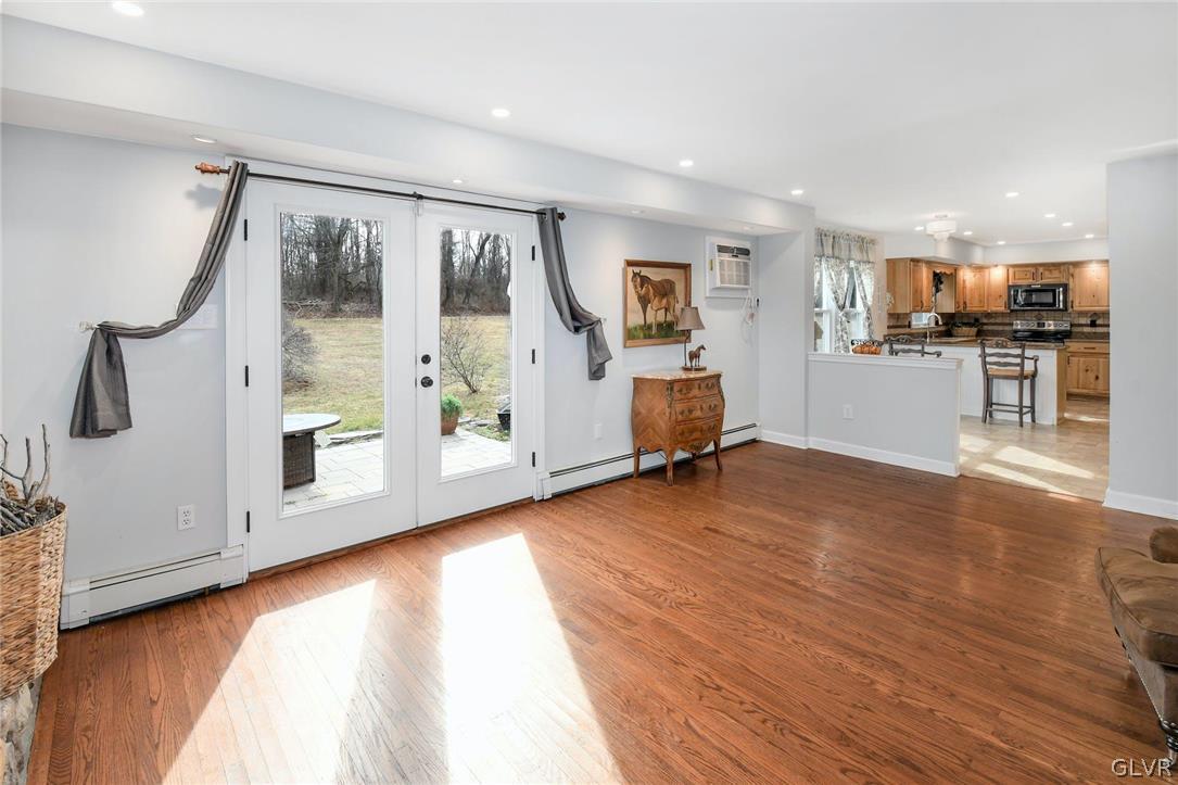 4384 Lehnenberg Road Riegelsville, PA 18077 - Photo 15 of 36 a view of a room with wooden floor and white walls