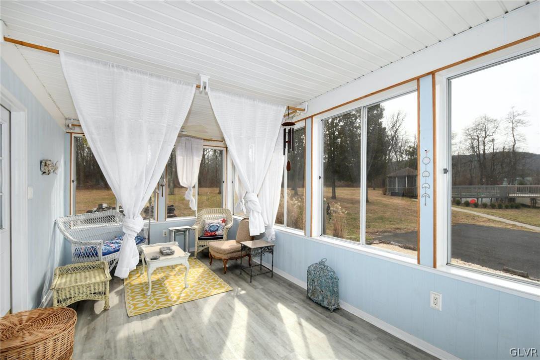 4384 Lehnenberg Road Riegelsville, PA 18077 - Photo 19 of 36 a living room with furniture and a large window