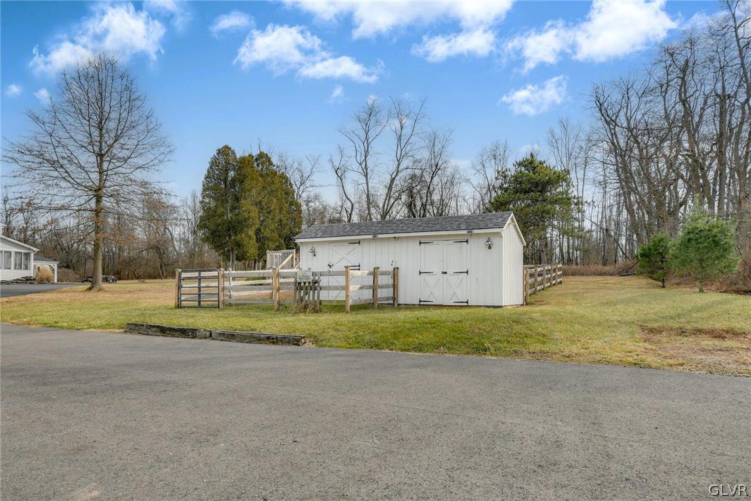 4384 Lehnenberg Road Riegelsville, PA 18077 - Photo 31 of 36 a view of a house with a yard
