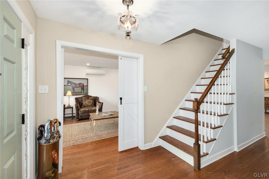 4384 Lehnenberg Road Riegelsville, PA 18077 - Photo 8 of 36 a view of a livingroom with stairs and furniture