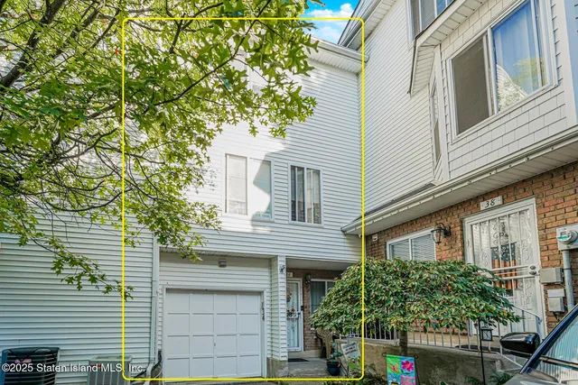 a view of a house with a tree