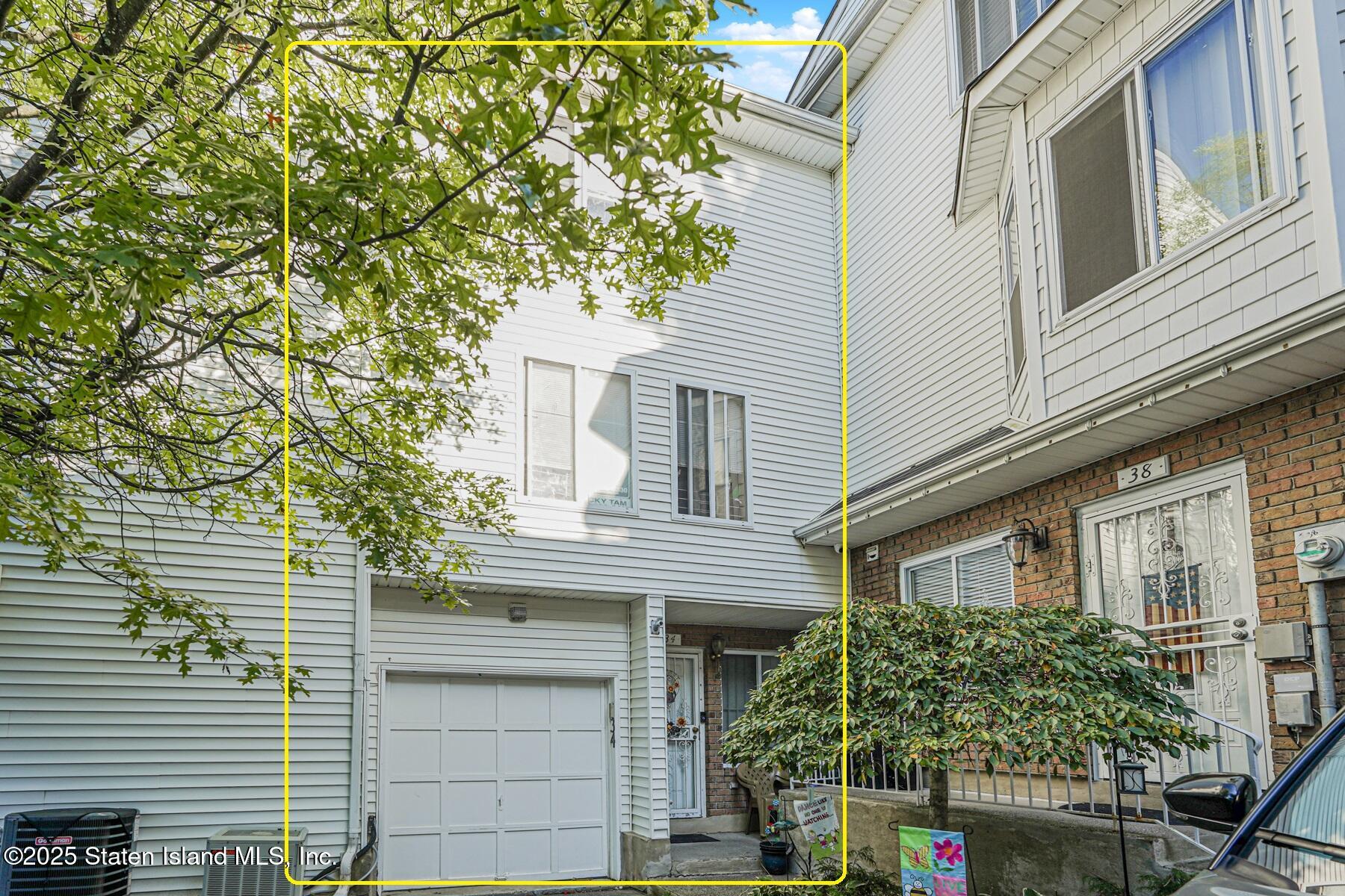 34 Jamie Lane Staten Island, NY 10312 - Photo 2 of 14 a view of a house with a tree