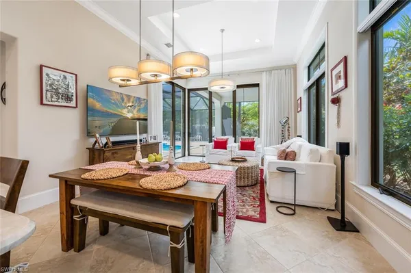 a very nice looking dining room with a large table and chairs