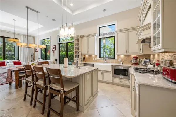 a kitchen with lots of counter top space and appliances