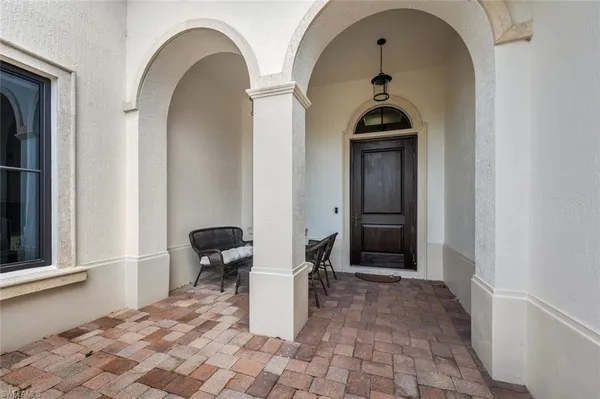a view of a entryway door with a hallway