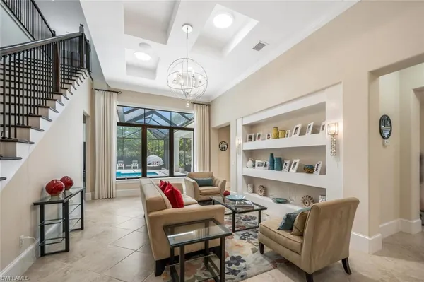 a living room with furniture or window and a chandelier