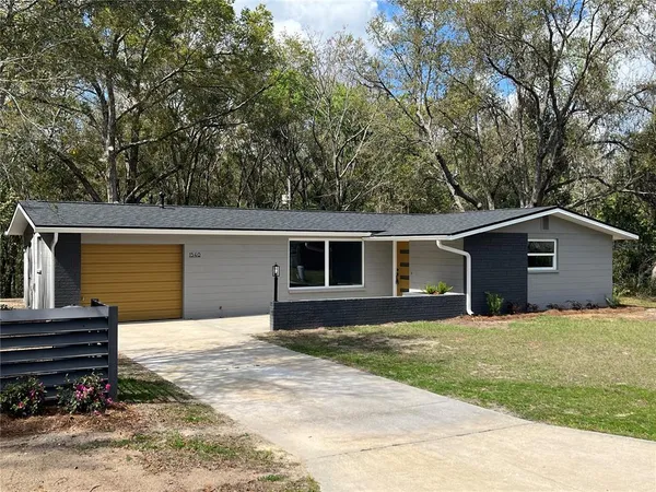 a house with trees in the background