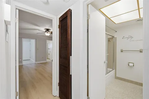 a view of a bathroom from a hallway