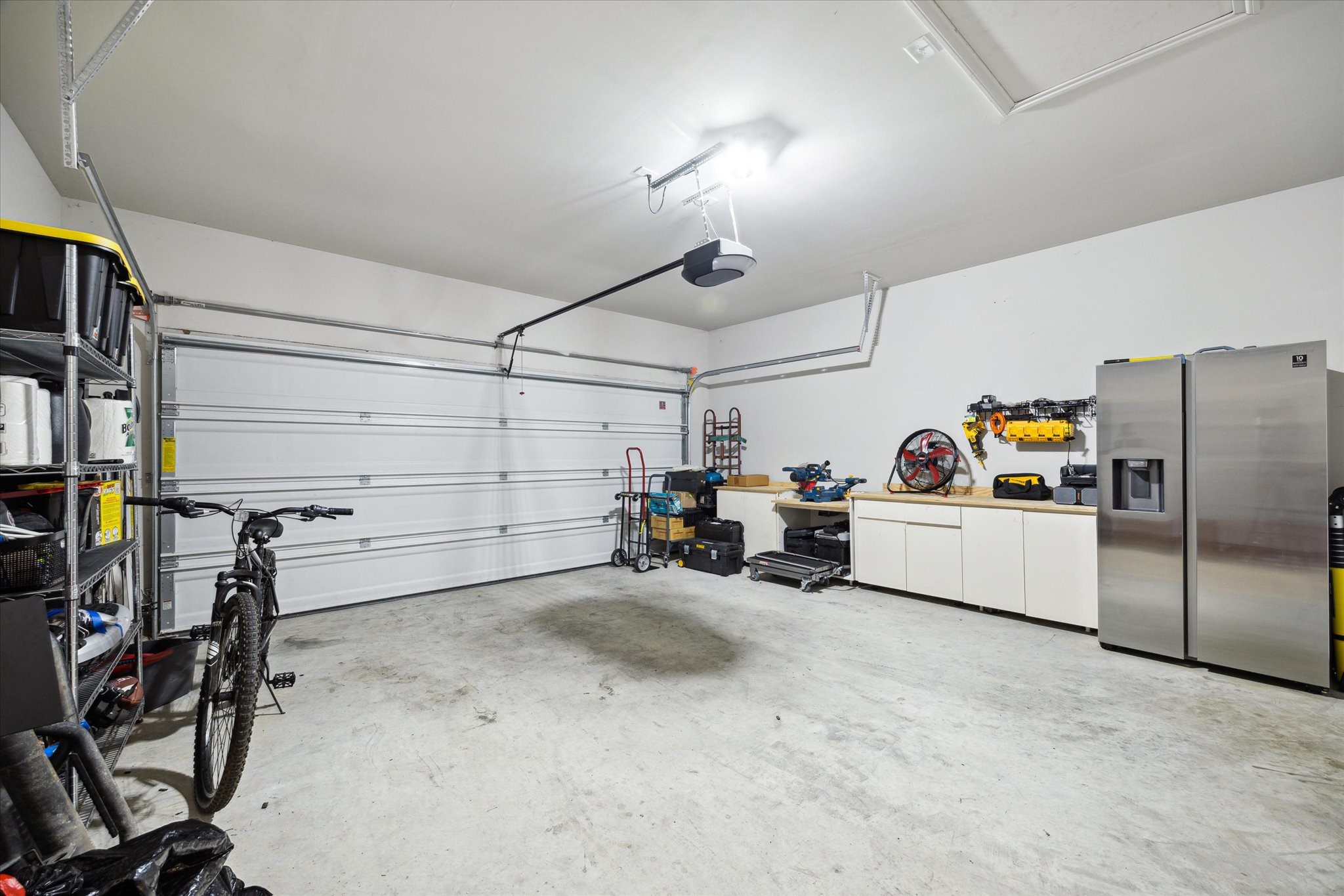 17218 Roxburgh Lake Lane Hockley, TX 77447 - Photo 29 of 36 a view of a garage with storage