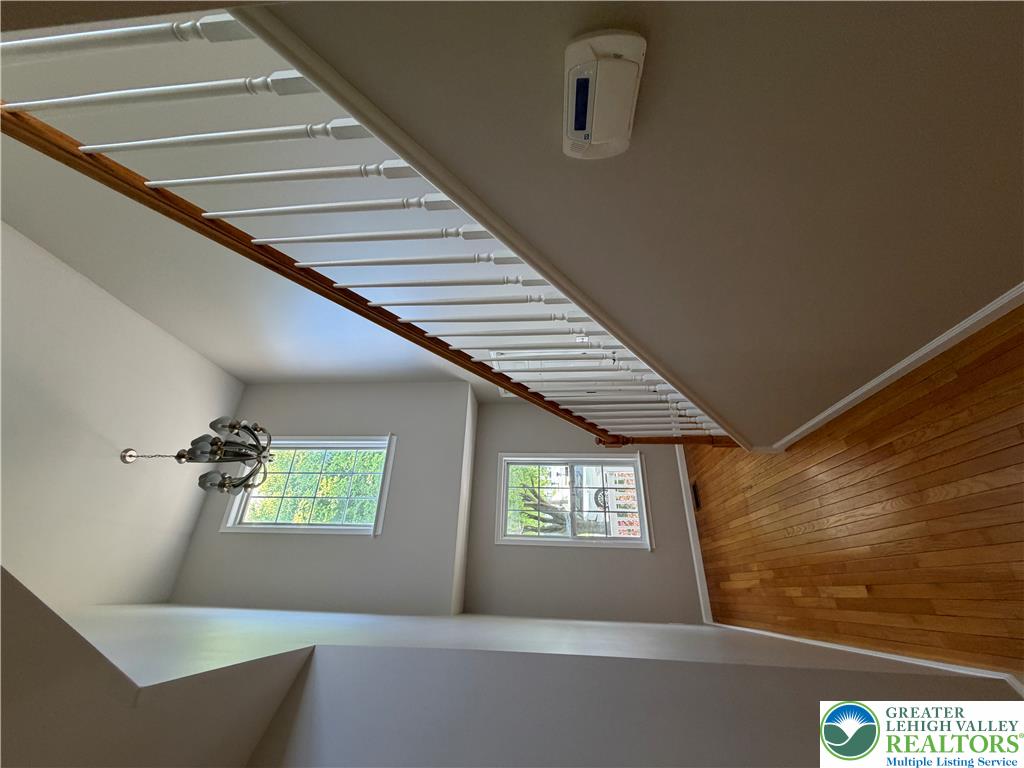 4157 Walter Road Bethlehem, PA 18020 - Photo 7 of 36 Hardwood floors and a classic baluster staircase define this welcoming entry space.