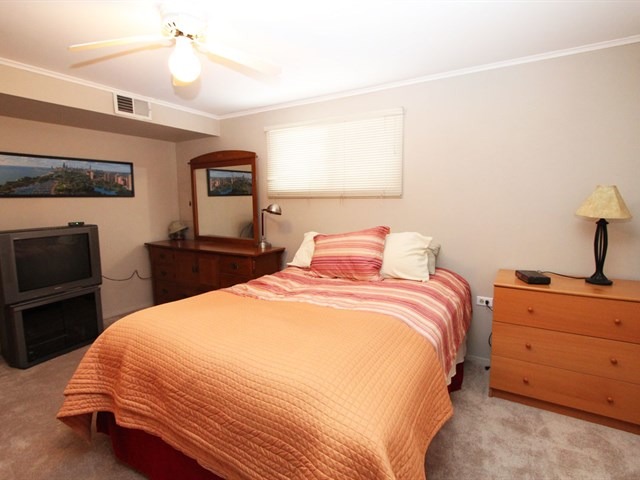 23 Crescent Road Lake Zurich, IL 60047 - Photo 11 of 18 a bedroom with a bed and wooden floor