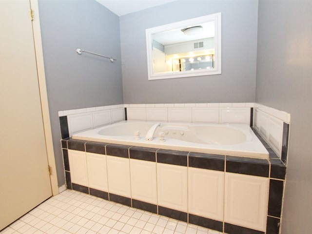 23 Crescent Road Lake Zurich, IL 60047 - Photo 13 of 18 a view of a bathroom with a sink