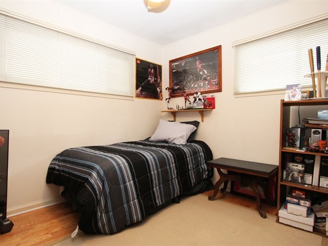 23 Crescent Road Lake Zurich, IL 60047 - Photo 14 of 18 a bedroom with a bed and a book shelf