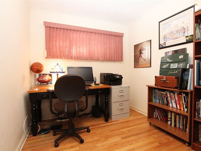 23 Crescent Road Lake Zurich, IL 60047 - Photo 16 of 18 a view of a workspace with furniture and a bookshelf
