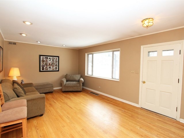 23 Crescent Road Lake Zurich, IL 60047 - Photo 2 of 18 a living room with furniture and a window