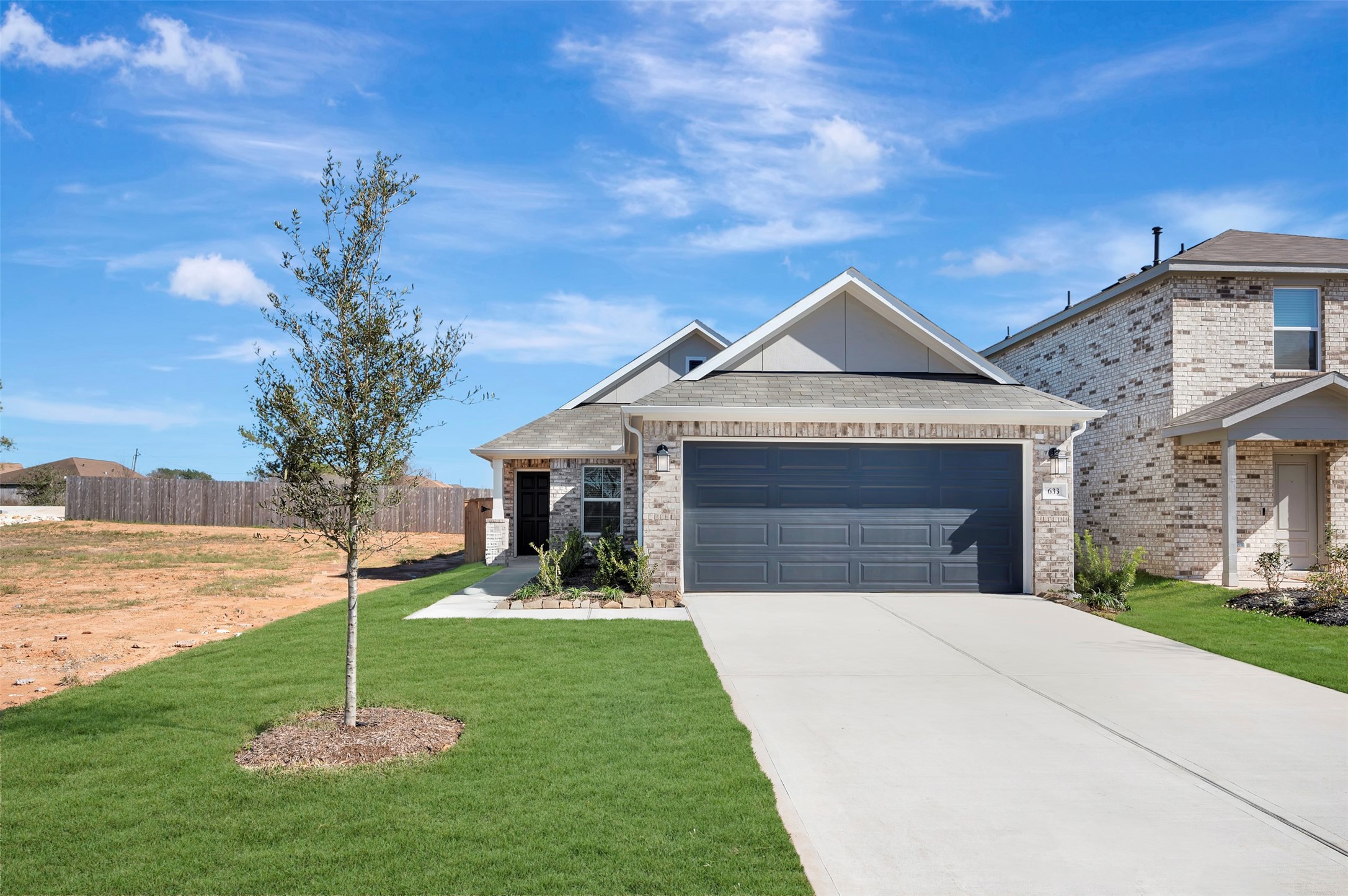 633 Falling Cave Drive Willis, TX 77378 - Photo 1 of 42 a house with garden in front of it