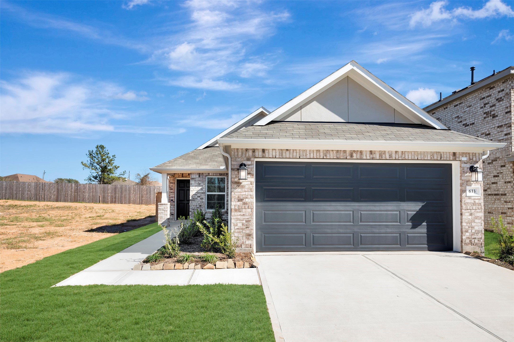 633 Falling Cave Drive Willis, TX 77378 - Photo 12 of 42 a front view of a house with garden