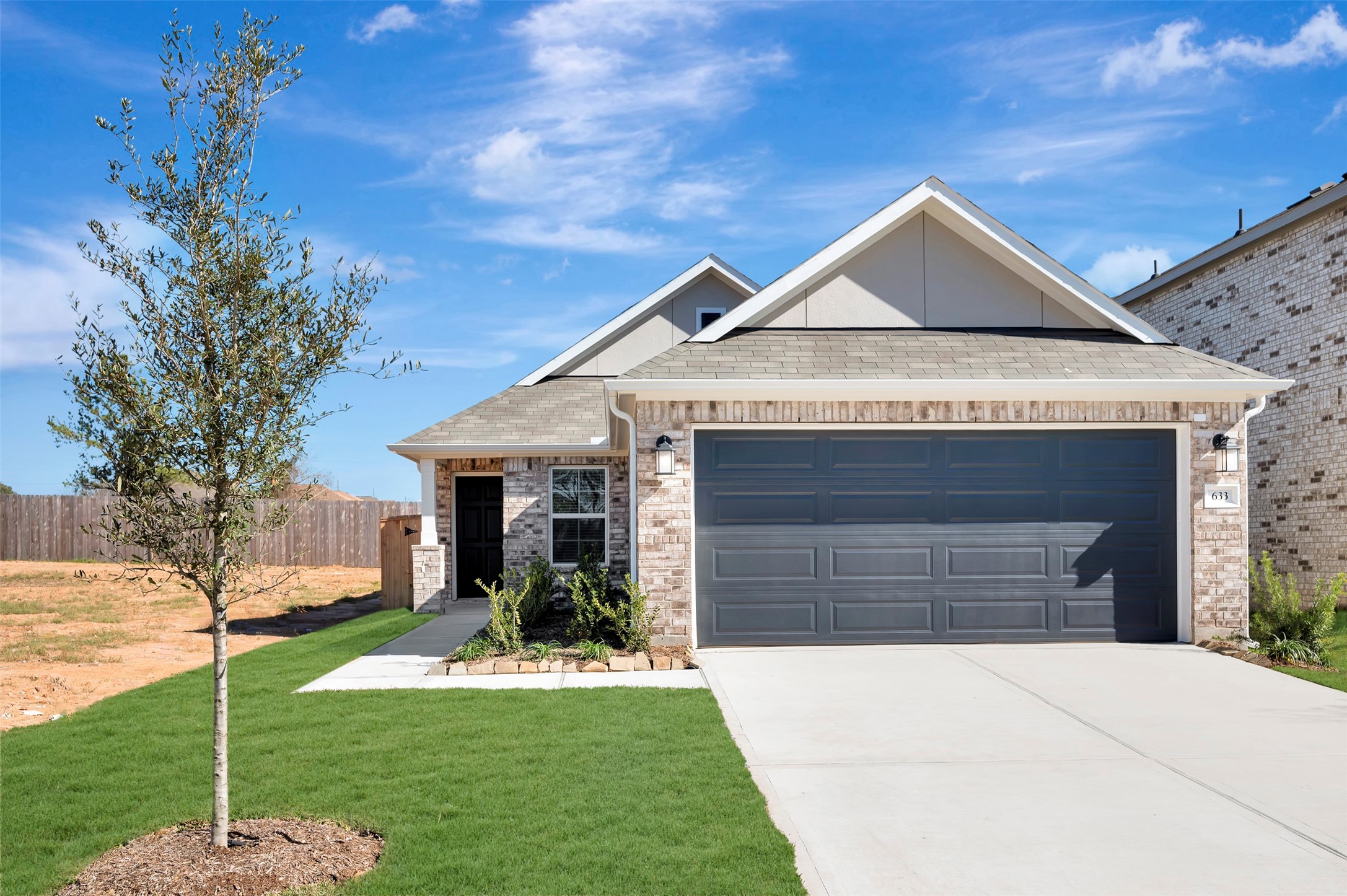 633 Falling Cave Drive Willis, TX 77378 - Photo 13 of 42 a front view of a house with a yard