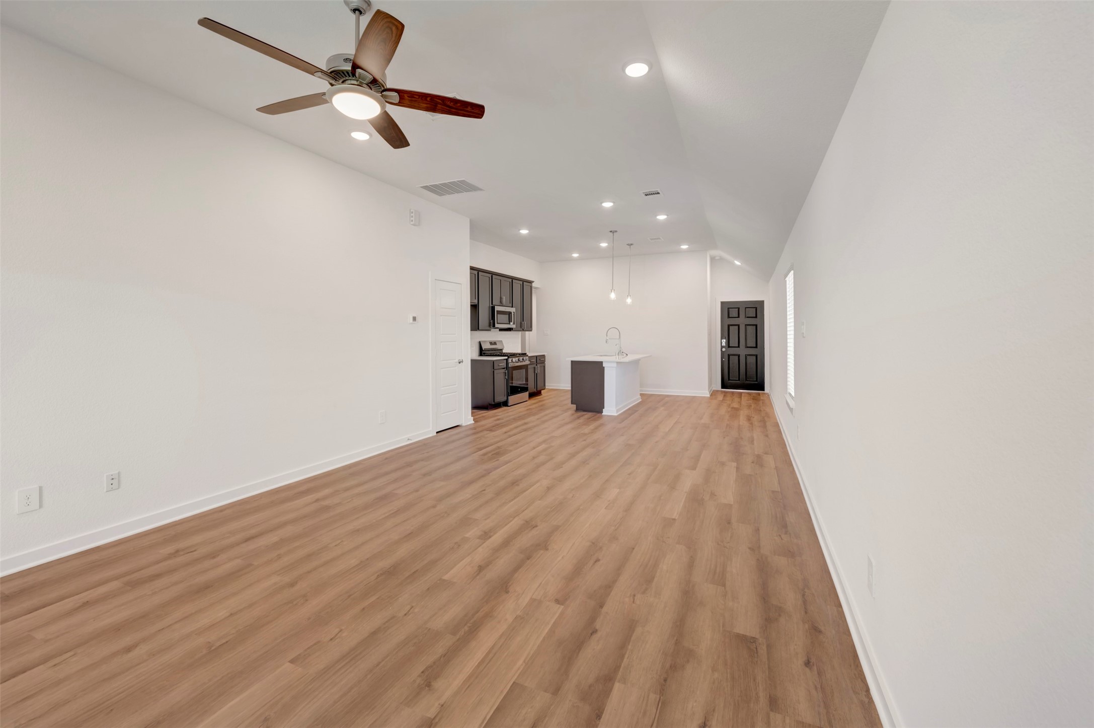 633 Falling Cave Drive Willis, TX 77378 - Photo 22 of 42 a view of a kitchen with a dishwasher and a refrigerator