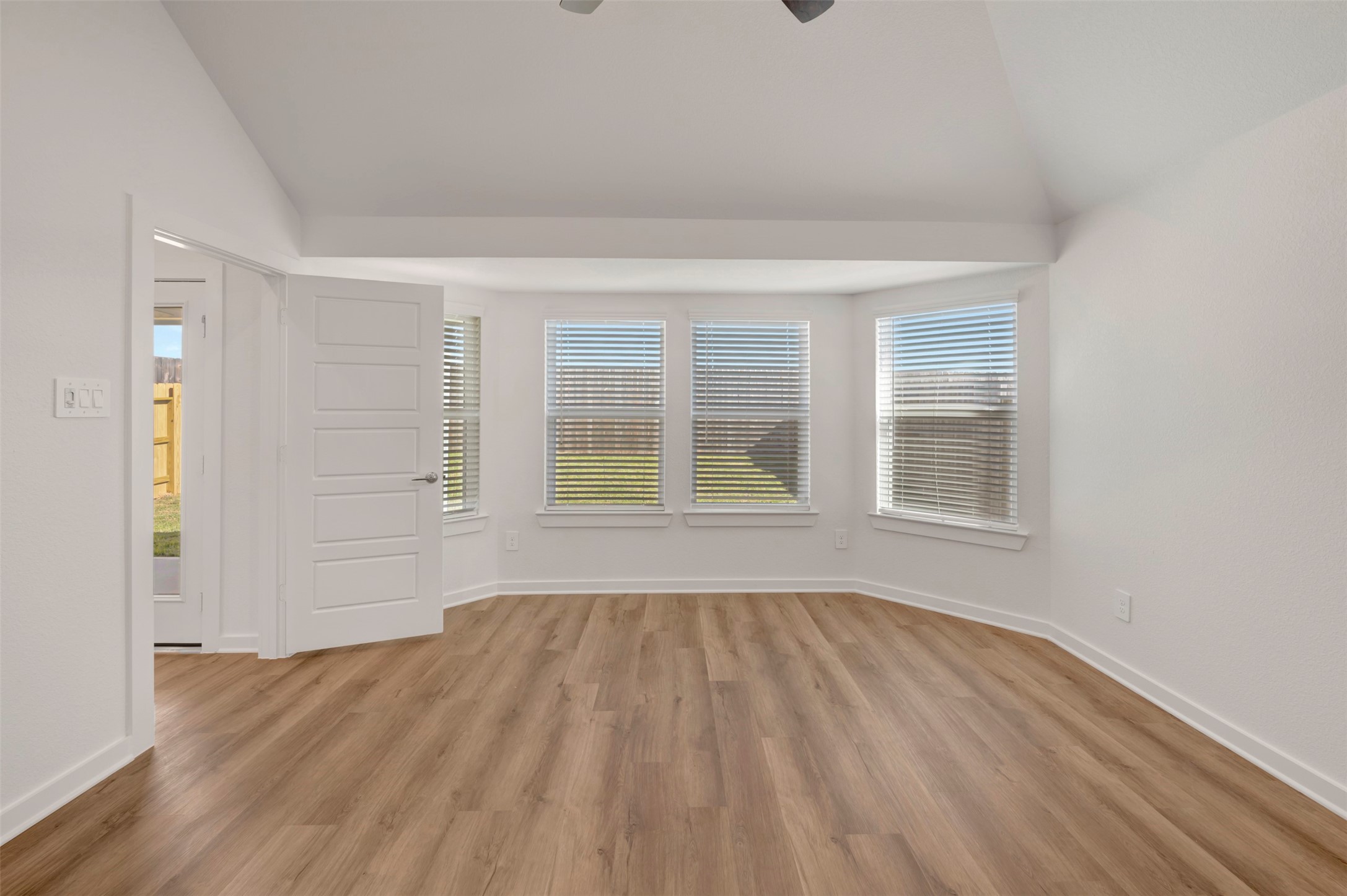 633 Falling Cave Drive Willis, TX 77378 - Photo 4 of 42 a view of empty room with wooden floor and fan