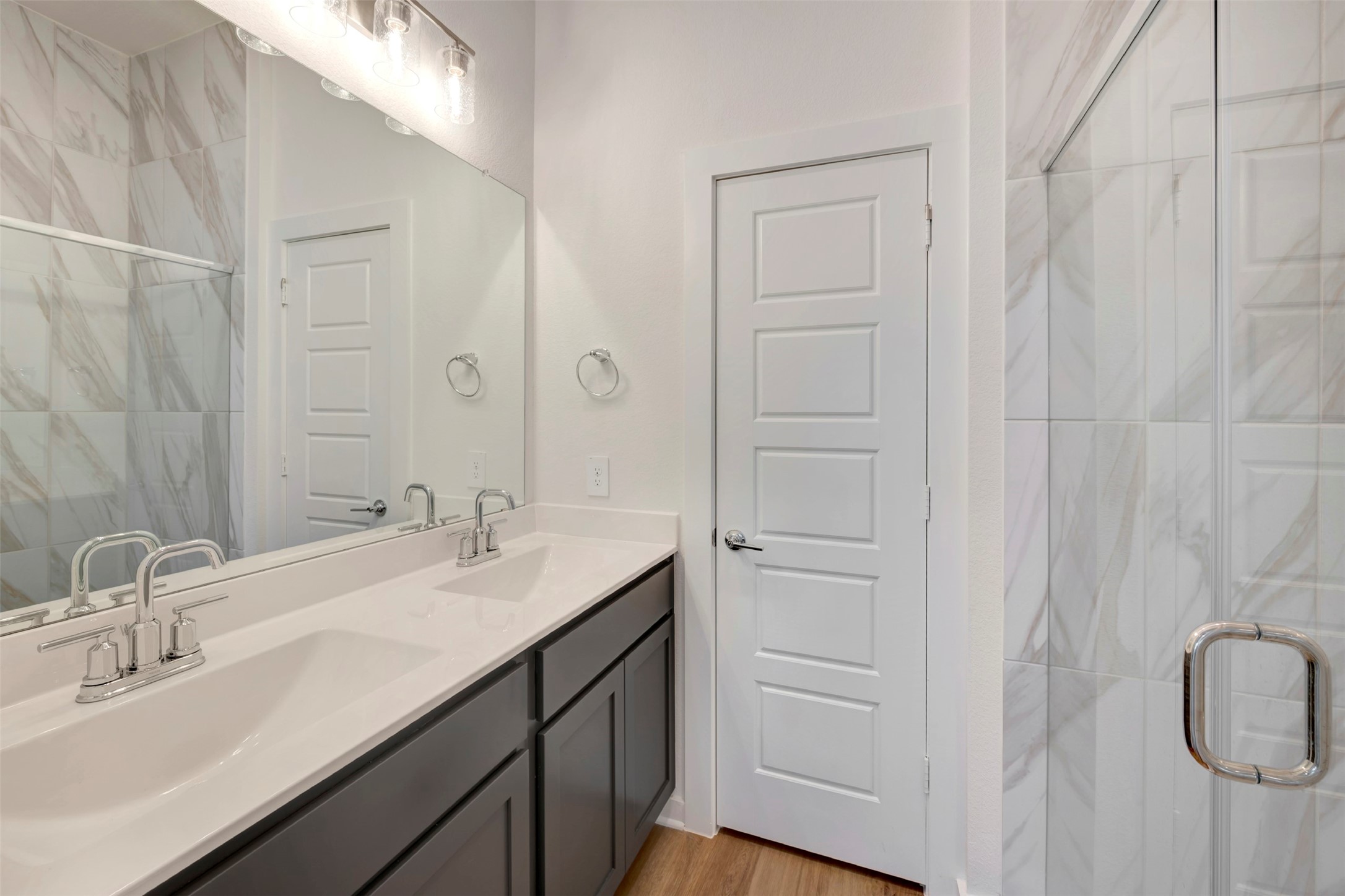 633 Falling Cave Drive Willis, TX 77378 - Photo 5 of 42 a bathroom with a double vanity sink a vanity and a mirror