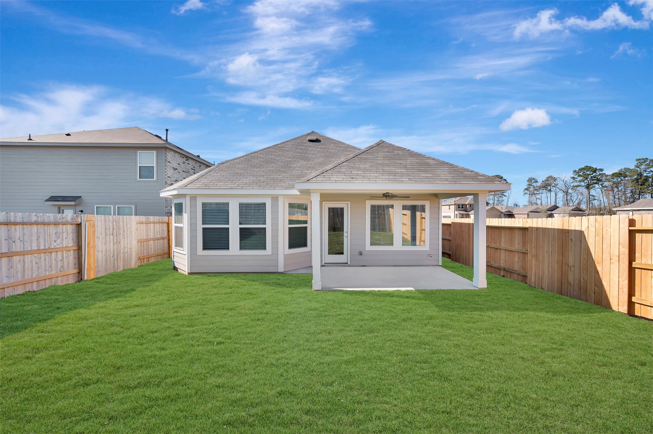 633 Falling Cave Drive Willis, TX 77378 - Photo 8 of 42 a view of a yard in front of a house with large tree