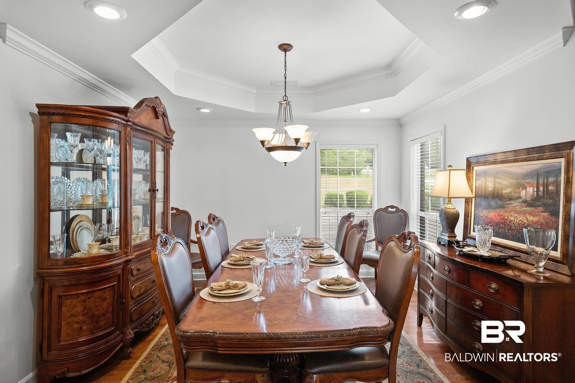 197 Morning Ridge Road Monroeville, AL 36460 - Photo 21 of 51 Dining area with a multi-tiered tray ceiling, recessed lighting, and crown molding