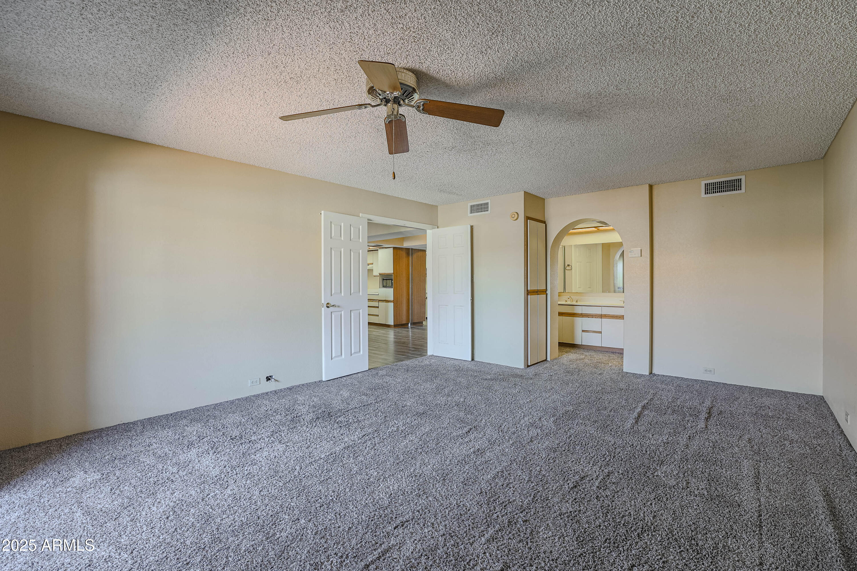 10410 North Cave Creek Road, Unit 2220 Phoenix, AZ 85020 - Photo 13 of 33 an empty room with closet and windows