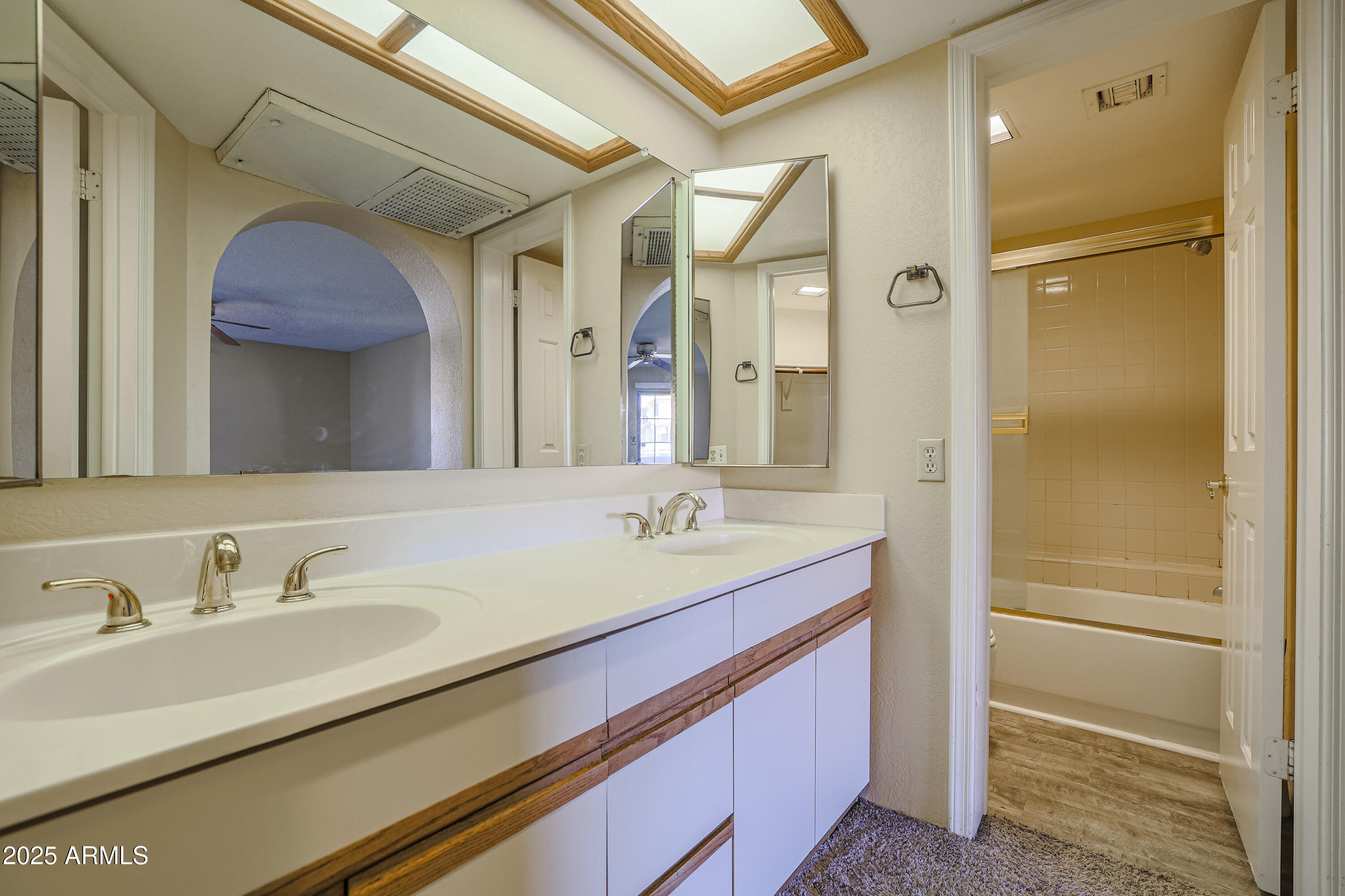 10410 North Cave Creek Road, Unit 2220 Phoenix, AZ 85020 - Photo 15 of 33 a bathroom with a sink and a mirror